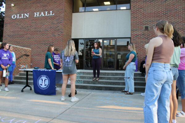 Arledge speaks before the walkathon about its purpose. Quoting Amanda Gorman’s inaugural speech, Arledge said, "There is always light, if only we're brave enough to see it, if only we're brave enough to be it” (Photo by Killian Altayeb).